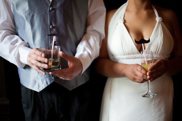 Bunn Salarzon - bride and groom holding drinks with mustache straws