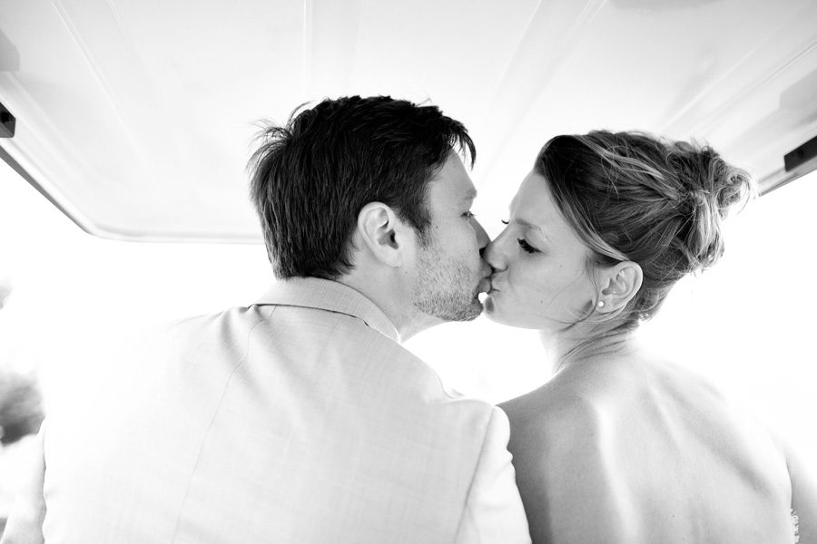Bunn Salarzon - bride and groom kissing on golf cart
