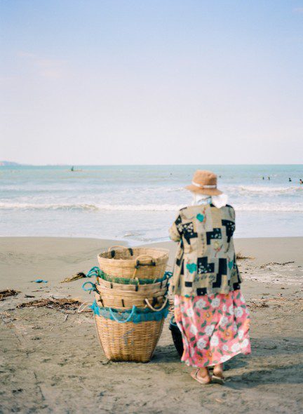 Bunn Salarzon - old woman selling live fish on the beach
