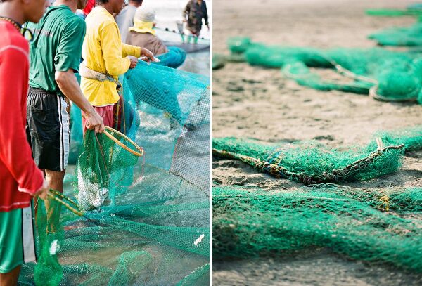 Bunn Salarzon - men pulling green fishing net