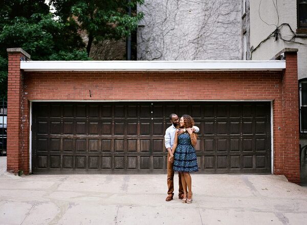Bunn Salarzon - guy hugging girl in front of garage door