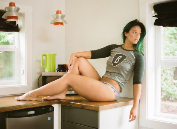 Bunn Salarzon - sexy woman lying on kitchen counter top