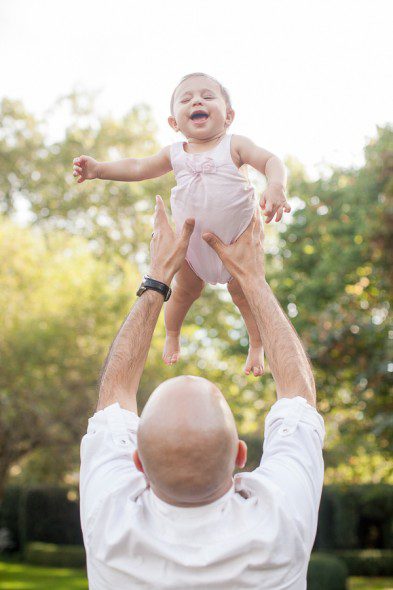 Bunn Salarzon - young father toss baby girl in the air