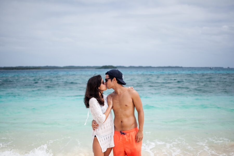 Bunn Salarzon - cute boy kissing girl on beach